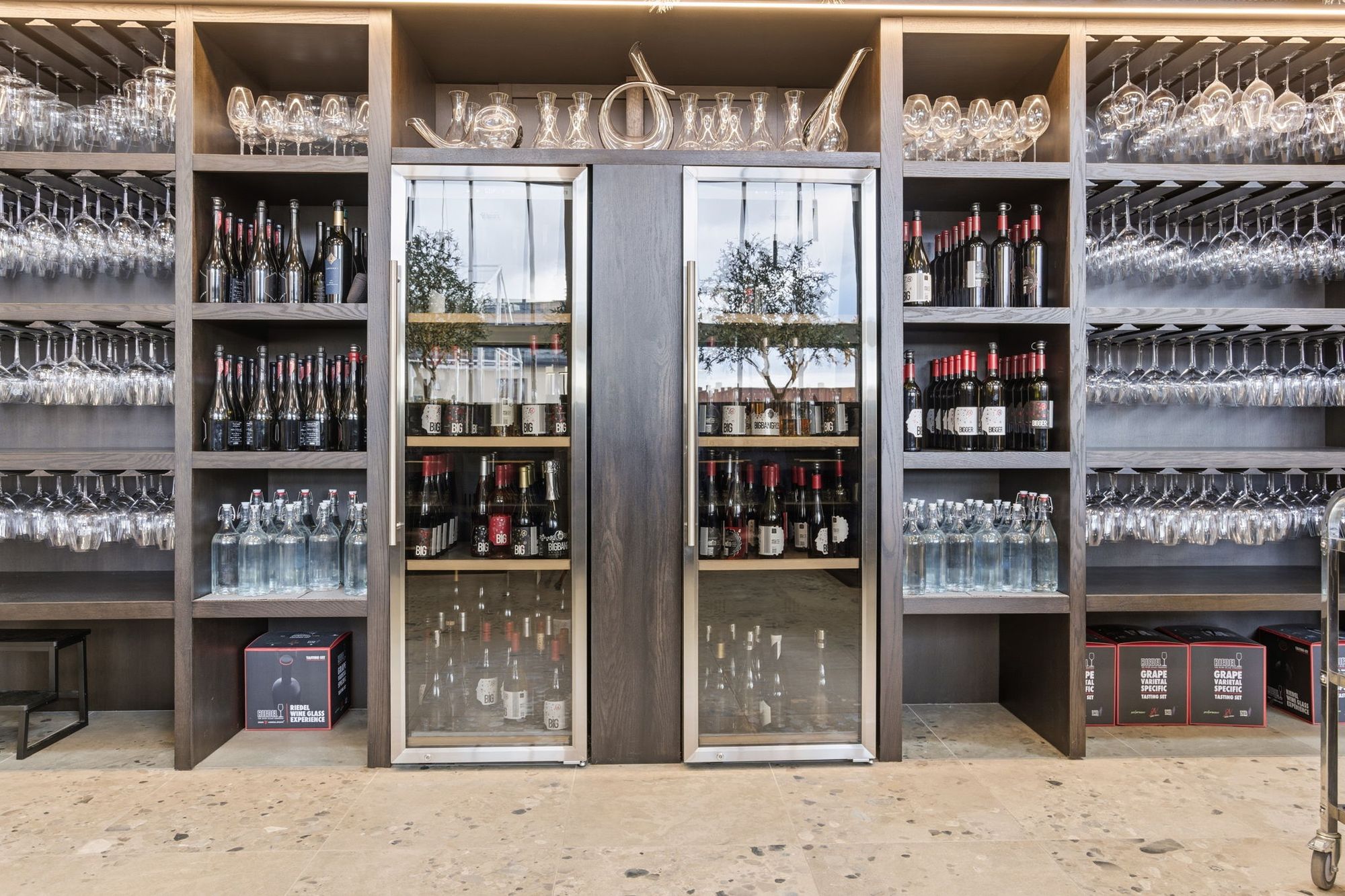 Glassware and wine fridges behind the bar
