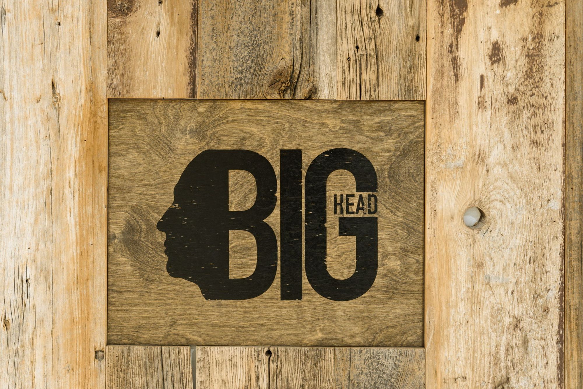 The Big Head mark on reclaimed wood