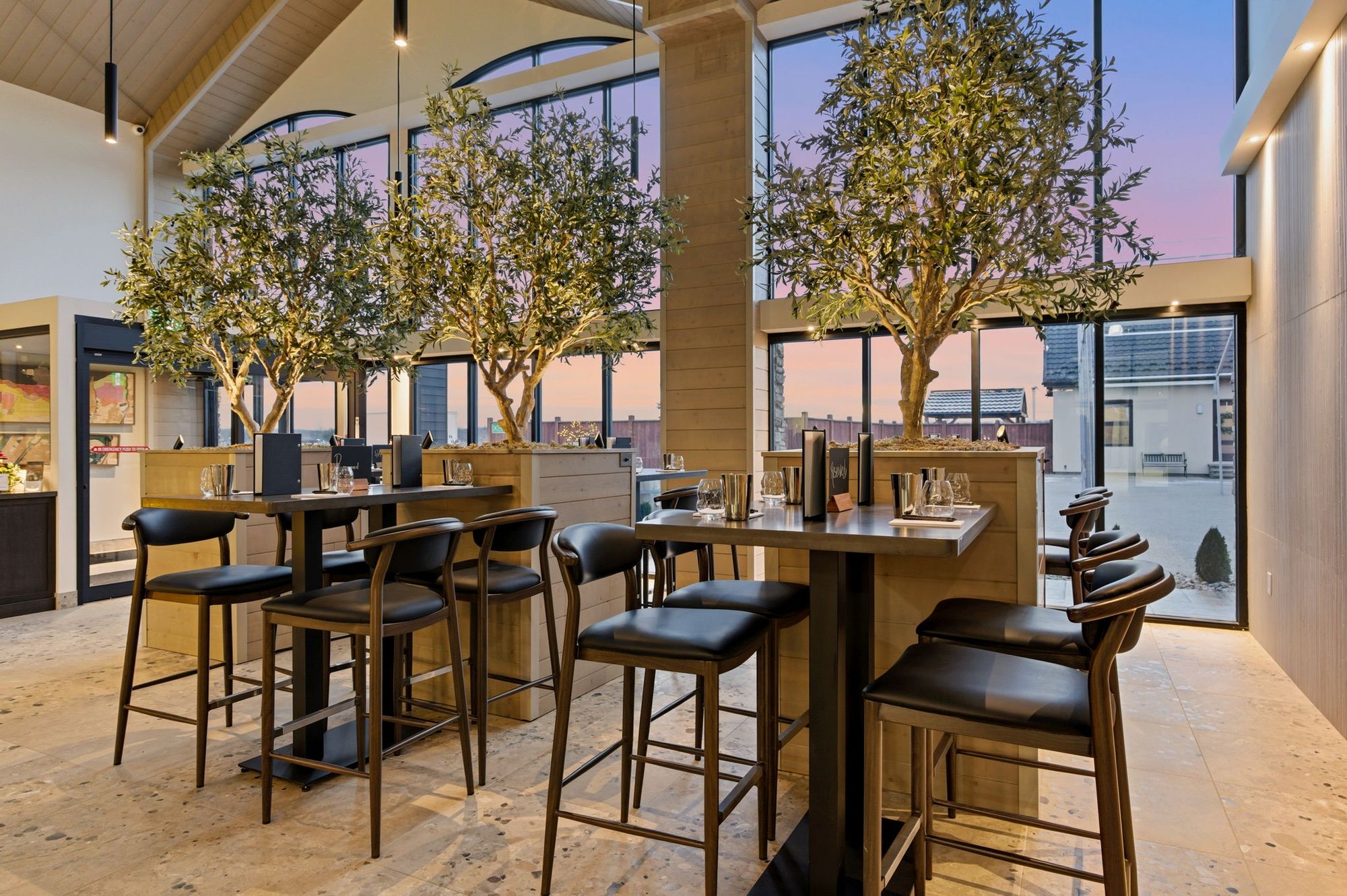 The olive-tree dining room at dusk